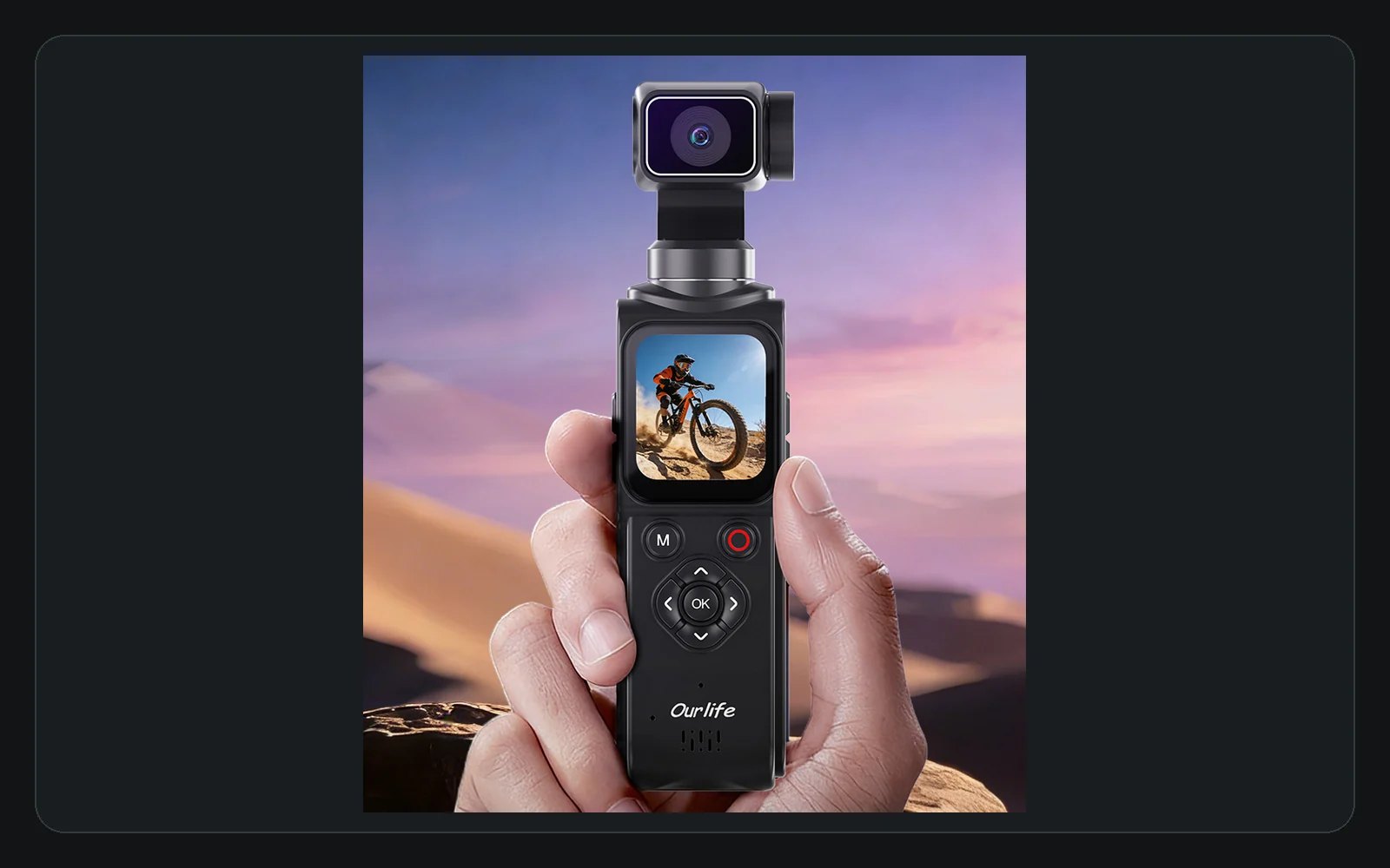 Hand holding a black Ourlife AT-M105 pocket camera in an outdoor creator scene